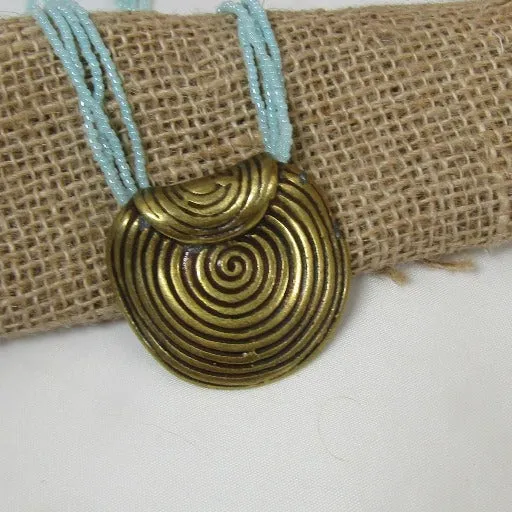 Aqua Multi-strand Necklace with Gold Spiral Disc Pendant